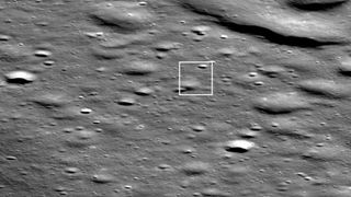 Firefly Aerospace’s Blue Ghost moon lander is seen as bright pixel casting a shadow in the middle of the box in this photo, which was captured by NASA’s Lunar Reconnaissance Orbiter on March 2, 2025.